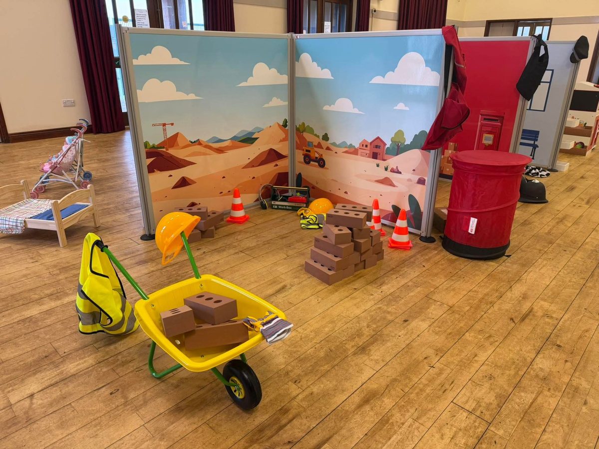 Toddler Town setup showing construction site, post office and police station