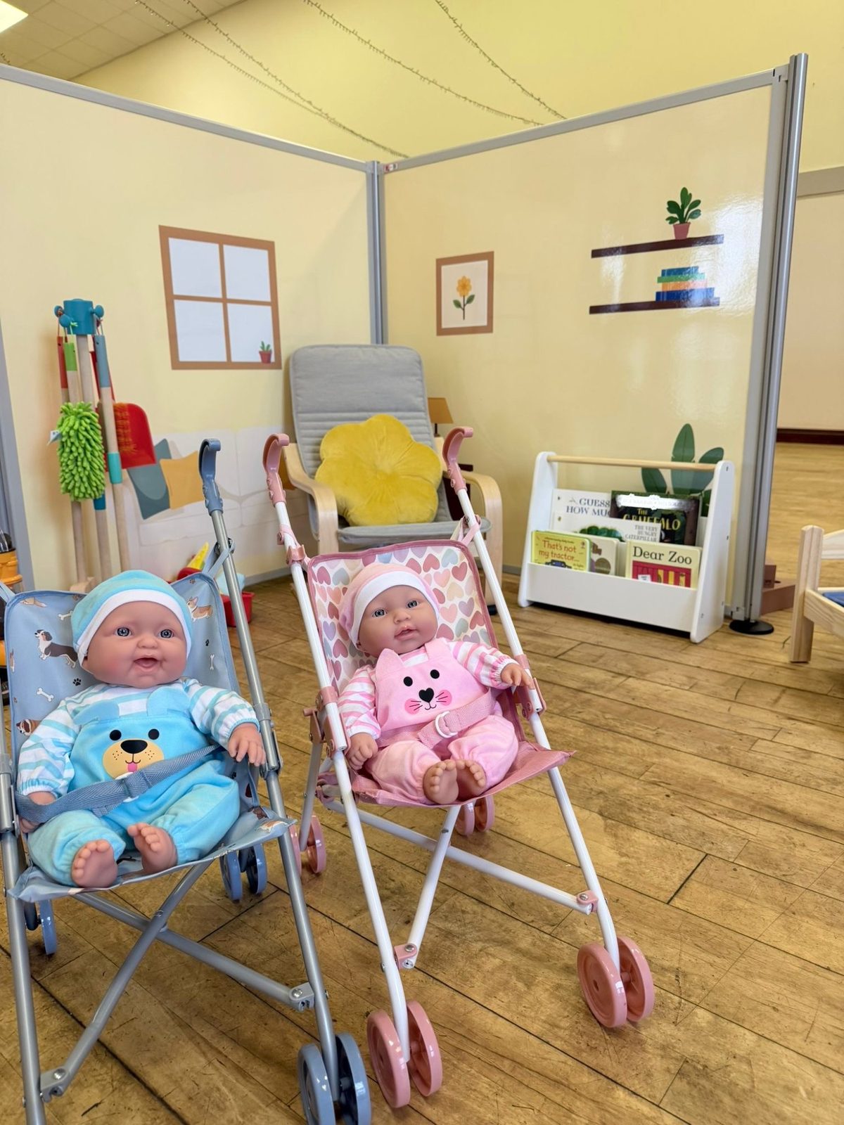 The Toddler Town cottage with dolls prams and reading corner